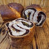 Traditional Romanian Cozonac sweet bread with chocolate, walnut, and orange zest swirl baked at Prestige Patisserie in North London