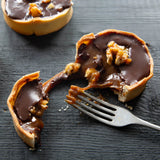 Prestige Patisserie tart with glossy chocolate and crunchy walnuts