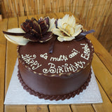 Personalised celebration cake with special chocolate flowers in North London patisserie
