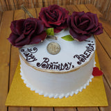 Prestige Patisserie whole cake with red chocolate roses design and chocolate message