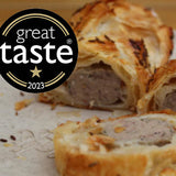 Twelve mini lamb sausage rolls in golden pastry with mint and cumin filling, Great Taste Award 2023 winner, handmade in North London bakery