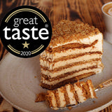 Award-winning Medovik honey cake with six burnt honey sponge layers and dulce de leche cream, handmade in North London bakery
