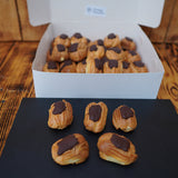 Order Mini Éclairs – Canapés (1 Kg) from Prestige Patisserie. Light choux pastry filled with crème pâtissière and topped with chocolate glaze. Perfect for any event. Collection only in North London.