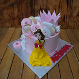 Handcrafted Princess Cake with pink and gold edible decorations, layered sponge, and custom design, made in North London patisserie