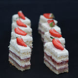 Enjoy bite-sized Victoria Sandwich Cake – Canapés (1 Kg) from Prestige Patisserie. Filled with raspberry jam and buttercream. Collection only from our North London bakery.