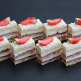 Enjoy bite-sized Victoria Sandwich Cake – Canapés (1 Kg) from Prestige Patisserie. Filled with raspberry jam and buttercream. Collection only from our North London bakery.