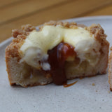 Apple crumble tart with golden shortbread crust, vanilla cream and caramel drizzle