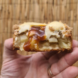 Apple crumble tart with golden shortbread crust, vanilla cream and caramel drizzle
