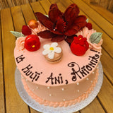 Personalised whole cake with special chocolate flower and chocolate message and macarons