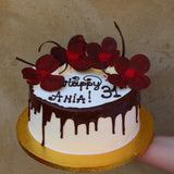 Prestige Patisserie birthday cake with chocolate flowers design and chocolate drip