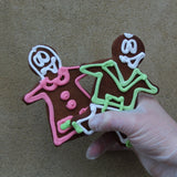Gingerbread cookies shaped like George and Geanina