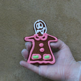 Gingerbread cookies shaped like George and Geanina