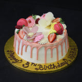 Prestige Patisserie birthday cake with chocolate flowers design and fresh berries and meringues