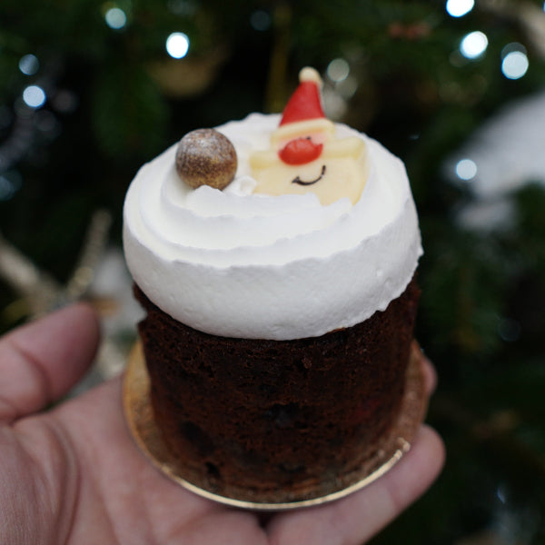Hand-decorated Christmas fruit cake soaked in brandy syrup from Prestige Patisserie.