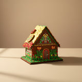 Hand-decorated Easter gingerbread house with royal icing flowers and bunny figures