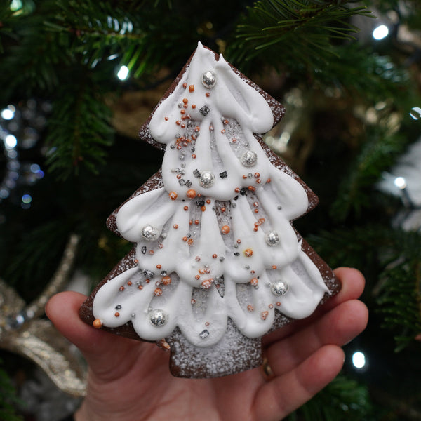 Handcrafted gingerbread tree biscuit with festive spices from Prestige Patisserie.