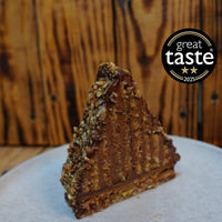 Multi-layered Mountain Cake with pecan & almond jaconde sponge, Belgian chocolate mousse, glossy honey-chocolate ganache and praline-studded pecan darcquoise base.