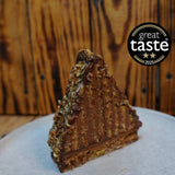 Multi-layered Mountain Cake with pecan & almond jaconde sponge, Belgian chocolate mousse, glossy honey-chocolate ganache and praline-studded pecan darcquoise base.
