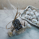 Packaged walnut cookies on a wooden surface