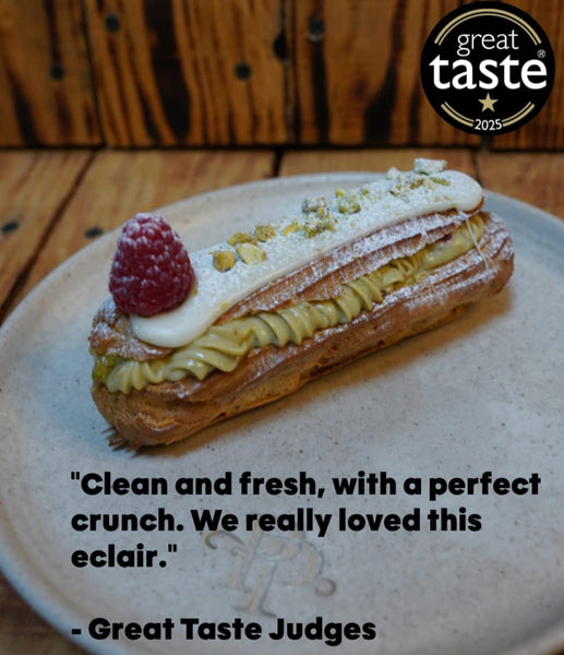 Freshly baked éclairs and cream puffs filled with vanilla custard and cream, made in our choux pastry masterclass