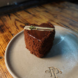 dark chocolate mousse heart shaped cake close up luxury bakery london