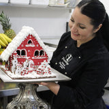 Prestige Patisserie showstopper gingerbread house in red icing gift box.