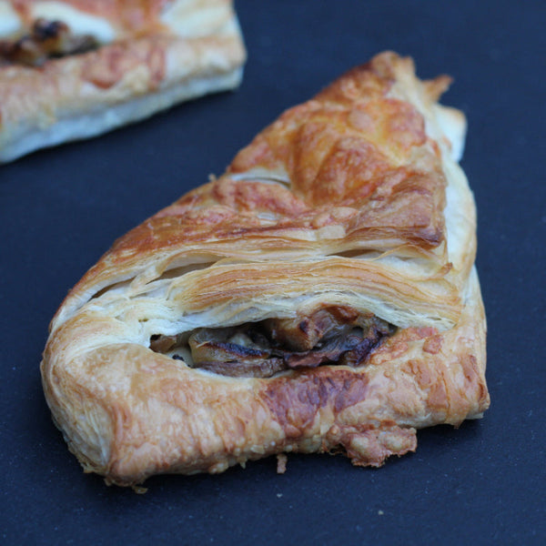 Vegetarian savoury puff pastry with mushrooms, onions, and cheese from Prestige Patisserie, North London.