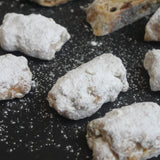 Assorted mini stollens dusted with icing sugar – festive pastries from Prestige Patisserie.